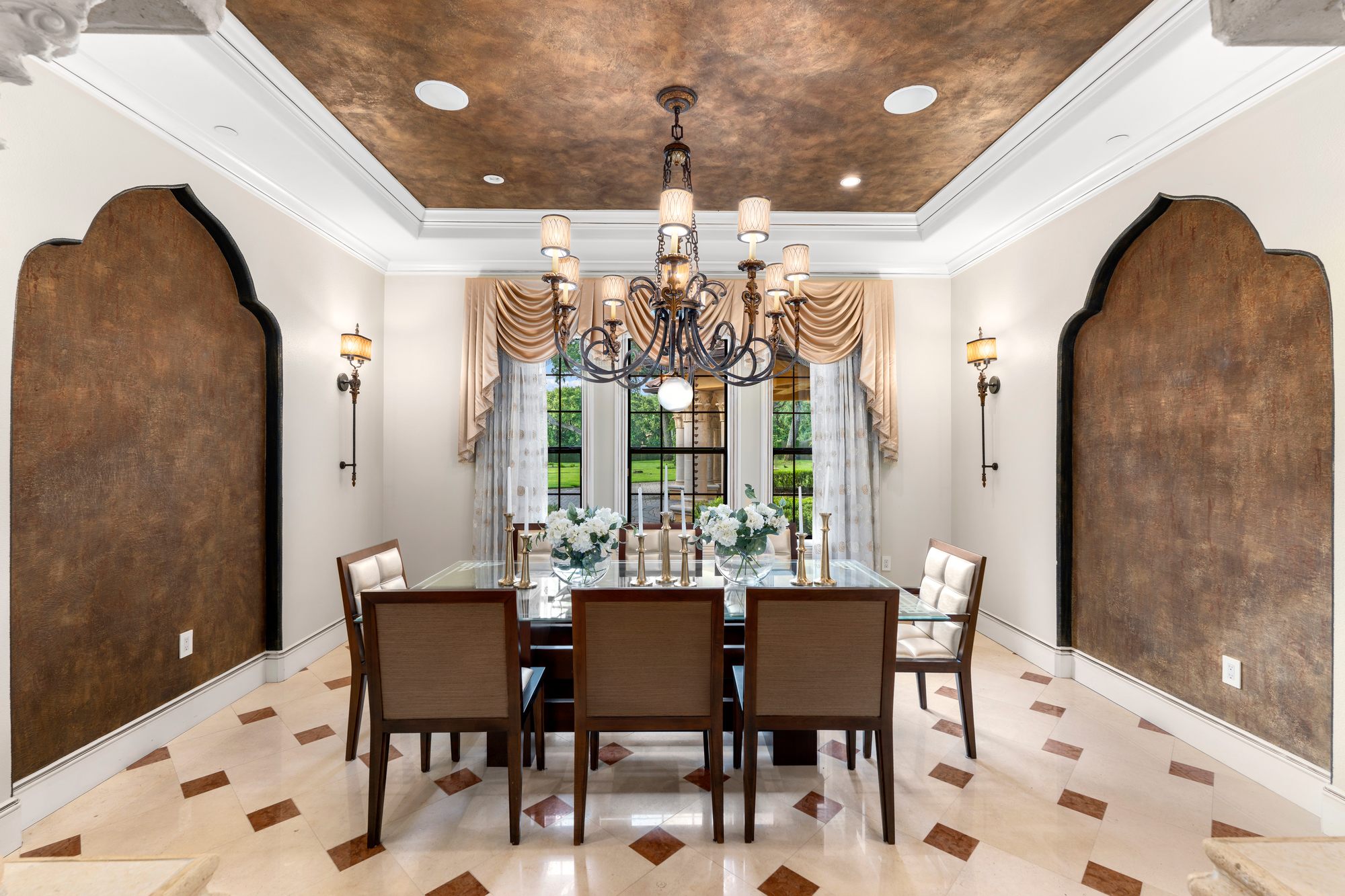 The two story foyer with custom stone medallion flooring