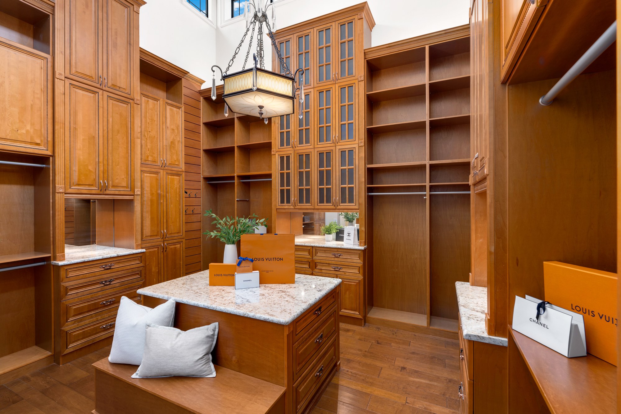 A custom walk-in closet with a center island